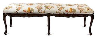 A Louis XV Style Carved Mahogany Bench Height 18 1/2 x length 60 x depth 18 inches.