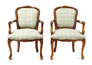 A Pair of Louis XV Style Walnut Fauteuils Height 34 inches.