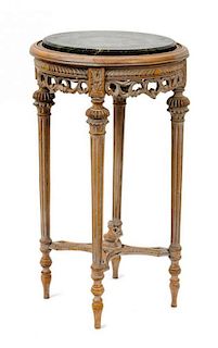 A Louis XVI Style Marble Top Gueridon Height 28 x diameter 16 inches. Height 28 x diameter16 inches.