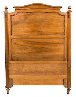 A Pair of Louis XVI Style Carved Walnut Twin Beds Height of headboard 58 inches.