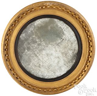 Massive Federal giltwood bull's-eye mirror