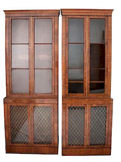 A Pair of George III Style Walnut Bookcase Cabinets Height 93 x width 31 3/4 x depth 17 1/2 inches.