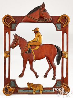 Carved and painted horse and jockey plaque