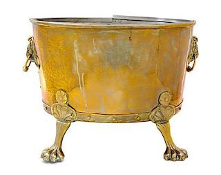 An English Brass Oval Jardiniere Height 12 3/4 x length 17 1/2 inches.