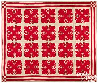 Red and white cutwork appliqué quilt