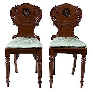 A Pair of Regency Mahogany Hall Chairs Height 33 inches.