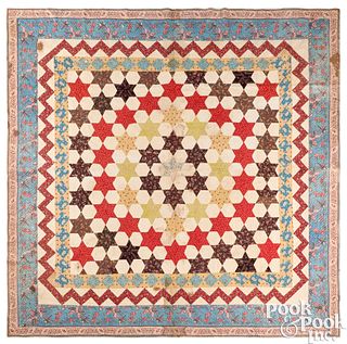 Large star pattern quilt with chintz border