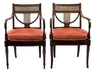 A Pair of Regency Ebonized and Gilt Painted Open Armchairs Height 34 1/4 inches.