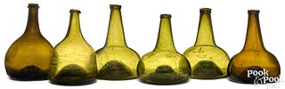 Five blown olive squat bottles, 18th c.
