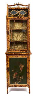 A Victorian Lacquered and Gilt Bamboo Display Cabinet Height 77 x width 22 1/4 x depth 16 1/2 inches.