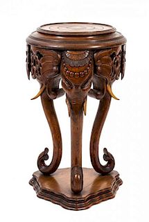 An Anglo-Indian Carved Oak Pedestal Table Height 39 x diameter 15 1/2 inches.