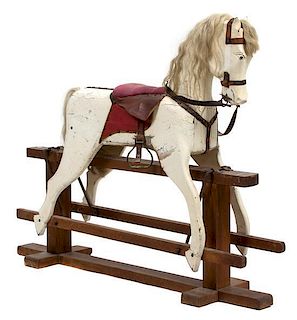An American Primitive Painted Rocking Horse Height 46 x width 54 x depth 12 inches.