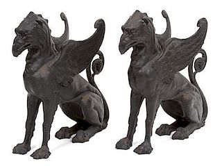 A Pair of Patinated Iron Gryphons Height 22 1/2 inches.
