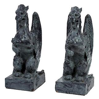 A Pair of Patinated Pottery Winged Gryphons Height 24 1/2 inches.