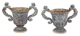 A Pair of Neoclassical Style Composition Campana Form Garden Urns Height 19 1/4 inches.