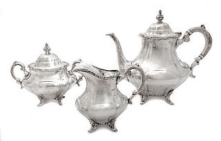An American Silver Three-Piece Coffee Service, Reed & Barton, Taunton, MA, comprising a coffee pot, a creamer and a covered s
