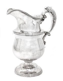 An American Silver Pitcher, Meriden Brittania Co., Meriden, CT, having an acanthus decorated C-scroll handle, reeded borders.