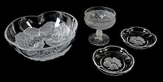 An Assembled Collection of Molded Clear and Frosted Glass Articles Diameter of largest 9 1/2 inches.