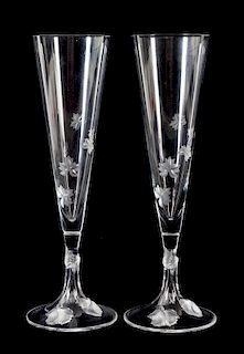A Set of Twelve Lalique Molded and Frosted Glass Champagne Flutes Height 10 inches.
