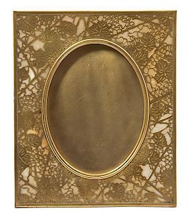 A Tiffany Studios Gilt Bronze Picture Frame 11 5/8 x 9 5/8 inches.