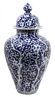 A Chinese Blue and White Covered Urn Height 28 inches.