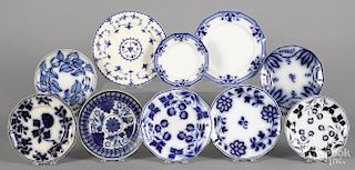 Twelve assorted blue and white porcelain plates, to include flow blue, stick spatter, etc.