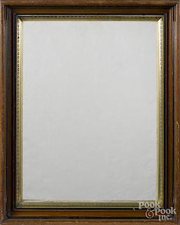 Three walnut frames with gilt liners, two with mirror inserts, together with an Empire mirror
