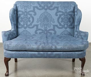 Queen Anne style mahogany loveseat.