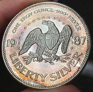 Toned 1987 A-Mark "Life Liberty Happiness" 1 ozt .999 Silver