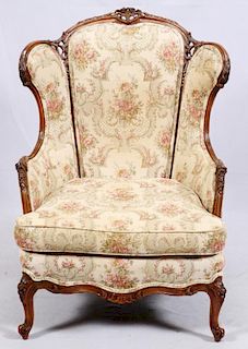 CONTINENTAL-STYLE CARVED WALNUT WINGBACK ARMCHAIR