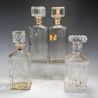 FOUR GLASS DECANTERS 