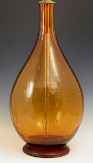 Large Mid Century Modern Blenko Amber Glass Lamp, 20th c., of baluster form, with air trap decoration, with a brass cap and a