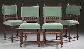 Set of Four Henri II Carved Walnut Dining Chairs,