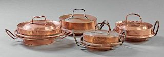 Group of Four Copper Shallow Pans, with integral r