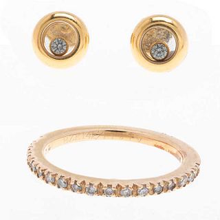 Media churumbela y par de broqueles con diamantes en oro amarillo de 14k y 18k de la firma Chopard y Bizzarro. Peso: 5.5 g.