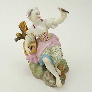 19th Century Meissen Porcelain Seated Girl with Bird Figurine