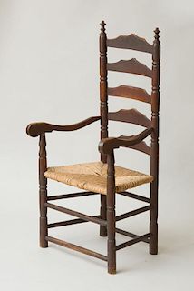 WILLIAM AND MARY BROWN PAINTED LADDER-BACK ARMCHAIR, NEW ENGLAND