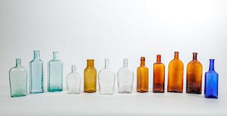 ASSEMBLED GROUP OF TWELVE GLASS BOTTLES