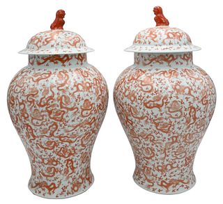 Pair of Chinese Iron-Red 'Dragon' Baluster Vases and Covers