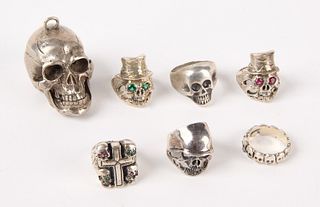Six Silver Skull Rings and a Large Skull Pendant