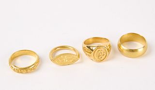 Four 22K Gold Rings