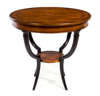 * A Biedermeier Style Parcel Ebonized Hardwood Table Height 28 x diameter of top 30 1/2 inches.