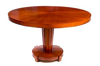 * An Art Deco Style Satinwood Veneered Table Height 29 x diameter of top 47 inches.