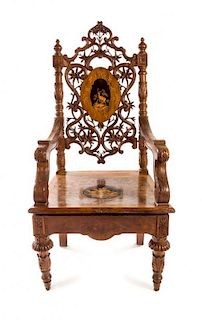 * A Black Forest Marquetry Armchair Height 49 3/8 inches.