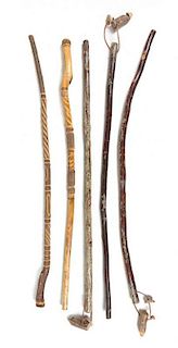 * A Group of Five Walking Sticks Length of longest 54 inches.