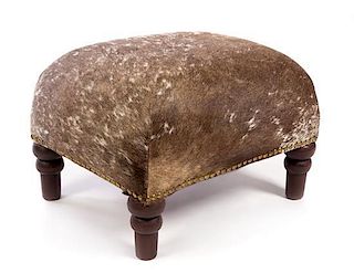 * A Cowhide Upholstered Foot Stool Height 13 1/4 inches.