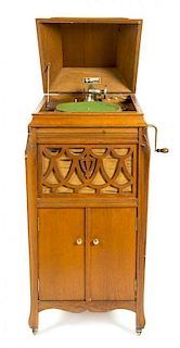 * A Wyeth Wycola Oak-Cased Phonograph Cabinet Height 45 x width 21 3/4 x depth 19 1/2 inches.
