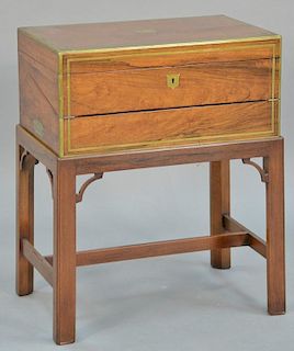 Rosewood brass bound lap desk on stand. 
height 25 inches, top: 13" x 20"