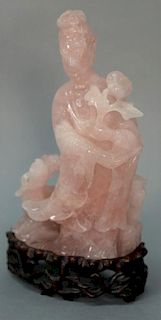Rose quartz figure of a female immortal and phoenix, the immortal shown holding a peony flower, early 20th century. 
(base dr