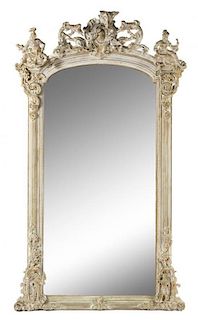 * A Rococo Style Cerused Wood and Composition Pier Mirror Height 94 x width 52 inches.
